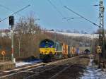 Auf dem Weg nach Aachen West kommt die Class66 PB20 von Crossrail mit lautem Gedrhne am 11.02.2012 mit einem Containerzug am Haken auf der KBS 480 durch Eilendorf. In Aachen West macht die Lok Kopf und es geht weiter ber die Montzenroute nach Antwerpen.