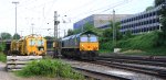 Ein Nachschuss von der Class 66 PB17 von der Rurtalbahn-Cargo fhrt als Lokzug aus Aachen-West nach Montzen(B) bei der Ausfahrt aus Aachen-West und fhrt in Richtung Belgien und auf dem Nebengleis steht eine Stopfmaschine und ein Schotterprofiliermaschine steht auf dem abstellgleis in Aachen-West in der Abendstimmung am Abend vom 18.6.2013.