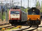 Die Class 66 DE6306 von DLC Railways rangiert in Aachen-West und auf dem Nachbargleis steht eine 185 599-8 von Crossrail mit Licht an und dahinter steht ein E186 126 auch von Crossrail und dahinter stehen 185er von Crossrail auf dem Abstellgleis in Aachen-West bei Sonne und Wolken am Nachmittag vom 18.4.2014.