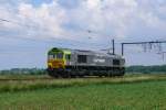 Die Class66 6601 von Captrain kommt solo von Antwerpen-Noord. Hier aufgenommen am 12/06/2010 an der Schleife bei Ekeren.