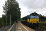 Die Class 66 V266/PB10 von der Rurtalbahn-Cargo  kommt als Lokzug und fährt die Kohlscheider-Rampe hoch aus Richtung Neuss und fährt in Richtung Aachen-West und fährt durch Kohlscheid in Richtung Richterich,Laurensberg,Aachen-West.
Bei Sonne und Regenwolken am Morgen vom 9.7.2015.