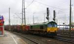 Die Class 66 RL001 von Railtraxx fährt mit viel Dieselpower mit einem KLV-Containerzug aus Bierset-Awans(B) nach Basel(CH) bei der Abfahrt aus Aachen-West und fährt in Richtung