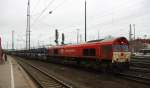 Die Class 66 PB03  Mireille  von Crossrail steht in Aachen-West mit einem sehr langen Fiat-Autozug aus Tychy(PL) nach  Zeebrugge(B) und wartet auf die Abfahrt nach Belgien.
Aufgenommen vom Bahnsteig in Aachen-West. 
Bei Nieselregen am Morgen vom 22.2.2016