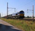 Die Claas66 der LWB (DE 6607) dröhnt mit einem Hochbordwagen-Ganzzug bei Dedensen-Gümmer in Richtung Seelze vorbei. Aufgenommen am 23.07.2014.