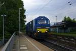 Eine Vossloh Dieselok G 2000 BB kommt als Lokzug aus Richtung Herzogenrath die Kohlscheider-Rampe hoch und fährt durch Kohlscheid in Richtung Richterich,Laurensberg ,Aachen-West. Bei Sonne und Wolken am Morgen vom 22.5.2014.