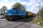 Spitzke SLG G1206-SP-021 unterwegs mit Kranwagen Oskar in Castrop-Rauxel am Bahnbergang Becklem am 15.07.2007.