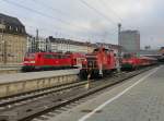 Die 111 123 mit einer RB, die 363 836 bei einer Rangierfahrt und die 218 489 mit einer RB am 01.12.2012 im Mnchner Hbf.