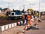 332 127-0 mit einem Bauzug (Erhhing des Bahnsteiges) auf Bahnhof Grevenbroich am 25-10-1994.