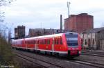 DB Regio 612 009 + 612 160 als RE 3614 Halle - Hannover vor der im Abriss befindlichen Malzfabrik Knnern Saale, KBS 330 Halle - Goslar / Bernburg, fotografiert bei der Ausfahrt Knnern am 07.10.2011