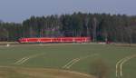 Der Regionalexpress Dresden - Nürnberg rauschte am 14.03.2014 durch das Vogtland, hier beim BÜ Drochaus auf dem weg nach Hof.