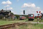 Eine Zugkreuzung im Bahnhof von Grieben: Am 21.07.2009 kreuzten sich der hier haltende 628 654 (links) als RE nach Szczecin Głwny und 628 207 (rechts), der Grieben als RE nach Kiel Hbf ohne Halt