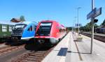 Links steht 642 800-6 der auf die Rückfahrt nach Cottbus wartet und rechts kommt der 641 028 mit dem RE 3048 aus Hof Hbf in Neuenarkt-Wirsberg gefahren. 07.06.2014