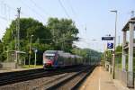 Zwei Euregiobahn (RB20) kommt aus Richtung Aachen-West,Laurensberg,Richterich und fährt durch Kohlscheid und fährt in Richtung Herzogenrath bei Sonne am Morgen vom 2.6.2014.