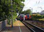 Zwei Euregiobahn (RB20) aus Heerlen(NL)-Stolberg-Altstadt-Düren kommt die Kohlscheider-Rampe hoch aus Richtung Herzogenrath und hält in Kohlscheid und fährt in Richtung Richterich,Laurensberg,Aachen-West.
Bei Sonne und Wolken am Morgen vom 7.7.2014.