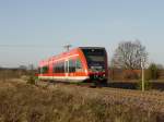 Ein Stadler GTW 646 von Wittstock(Dosse) kommend als RE6 nach Berlin-Spandau bei Einfahrt in Fretzdorf; 28.11.2011 

