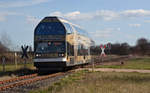 670 003 passiert am 26.03.17 auf dem Weg nach Dessau den Bahnübergang in Dessau-Mildensee.