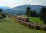 Der Schienenbus 798 706 + 798 776 + 998 840 der Passauer Eisenbahnfreunde bei einer Sonderfahrt auf der Ilztalbahn von Passau nach Freyung am 03.10.2012 unterwegs bei Karlsbach.