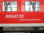 regio db franken - sachsen - express auf einem wagen des 612 das bedeutet fr reisende dresden hauptbahnhof - nrnberg hauptbahnhof.entstanden ist dieses bild am dresdener hauptbahnhof in den scheiben spiegelt sich die stahlkonstruktion des bahnhofs.26.01.2007