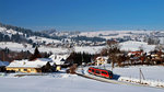 Im wünderschönen Winterlandschaft bummelt am 26.01.2013 642.082 mit dem RB 5511 vonKempten nach Reutte in Tirol durch die häuser in Wertach-Haslach.