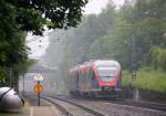 Ein Nachschuss von Zwei Euregiobahn (RB20) aus aus Langerwehe-Stolberg-Altstadt nach Heerlen(NL) und hilt in Kohlscheid und fährt die Kohlscheider-Rampe herunter nach Herzogenrath.
Bei Regenwetter am Morgen vom 27.5.2014.