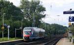 Die Euregiobahn (RB20) kommt aus Richtung Aachen-West,Laurensberg,Richterich und fährt durch Kohlscheid und fährt in Richtung Herzogenrath bei Sonne und Wolken am Morgen vom 18.8.2014.