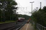 Zwei Euregiobahn (RB20) kommt aus Langerwehe-Stolberg-Altstadt nach Heerlen(NL) aus Richtung Aachen-West,Laurensberg,Richterich und hält in Kohlscheid und fährt in Richtung Herzogenrath.
Bei Regenwetter am Morgen vom 19.8.2014.