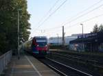 Zwei Euregiobahn (RB20) aus Heerlen(NL)-Stolberg-Altstadt-Düren kommt die Kohlscheider-Rampe hoch aus Richtung Herzogenrath und hält in Kohlscheid und fährt in Richtung Richterich,Laurensberg,Aachen-West. 
Bei schönem Sonnenschein am Morgen vom 12.9.2014.