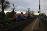 Die Euregiobahn (RB20) kommt aus Langerwehe-Stolberg-Altstadt nach Heerlen(NL) aus Richtung Aachen-West,Laurensberg,Richterich und hilt in Kohlscheid und fährt in Richtung Herzogenrath. 
Bei Sonne und Regenwolken am Morgen vom 11.11.2014.