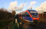 Zwei Euregiobahn (RB20) aus Heerlen(NL)-Stolberg-Hbf kommen die Kohlscheider-Rampe hoch aus Richtung Herzogenrath und halten in Kohlscheid und fahren in Richtung Richterich,Laurensberg,Aachen-West. 
Bei Sonne und Wolken am Kalten Nachmittag vom 26.11.2015.