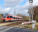 644 017 kam am 2.3.16 als RB38 von Neuss kommend über den Bahnübergang Blumenstraße in Grevenbroich gefahren.