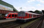 Hier links 648 264-1 als RB14217 von Bad Harzburg nach Gttingen und rechts RE14067 von Hannover Hbf. nach Bad Harzburg, diese beiden Zge trafen sich am 22.5.2011 in Bad Harzburg.