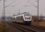 In der Rckansicht ist eine RE 10 nach Kleve von hinten zu sehen, gerade ist sie noch ber den Bahnbergang Broicherseite Tilmeshof vorbergfahren am 10.3.2012