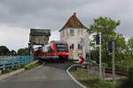 DB 648 349 überquert die Schleibrücke Lindaunis als RE72 zur Fahrt nach Flensburg. (29.05.2022)