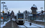 Im verschneiten Bahnhof Aschersleben wartet Abellio-Lint 1648 915 auf die Abfahrt Richtung Magdeburg.