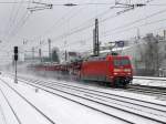Die 101 046 mit einem Autoreisezug am 14.02.2010 bei der Durchfahrt am Heimeranplatz (Mnchen).