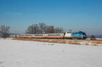 101 055  Schauinsland Reisen  fährt mit dem IC 2083 durchs noch winterliche Chiemgau, aufgenommen am 28.