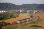 120 106 bringt am Morgen des 24.07.08 CNL 261 Paris Est - Mnchen Hbf ab Stuttgart Hbf bis Mnchen Hbf, aufgenommen am Km 72,2 der Filsbahn (KBS 750) bei Lonsee.