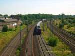 Eine Lok der Baureihe 120 schiebt ihren IC dem Fahrtziel Leipzig Hbf entgegen. Fotografiert bei der Ausfahrt aus Bitterfeld.