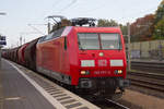 145 077-4 mit einem Getreidezug bei der Durchfahrt den Bahnhof Ashausen.