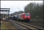 145001-4 kommt hier am 3.2.2007 bei trübem Wetter mit einem gemischten Güterzug in Richtung Osnabrück durch den Bahnhof Natrup Hagen.
