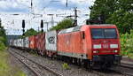 DB Cargo AG, Mainz mit ihrer  145 048-5  [NVR-Nummer: 91 80 6145 048-5 D-DB] und einem Containerzug am 07.05.24 Höhe Bahnhof Saarmund.