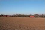 145 035 bringt bei Holzwickede einen FIR von Hagen-Vorhalle Richtung Hamm (Westf). (16.02.2008)