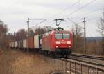 145 060-0 kommt am 27.02.10 mit einem langen Containerzug durch Hamburg-Moorburg gepoltert und wird gleich den Rbf Alte Sderelbe erreichen.