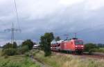 145 011-3 fuhr am 17.07.2012 mit einem Gterzug von Emden nach Osnabrck, hier sdlich von Leer.