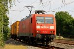 145 014-7 von  Railion kommt durch Eschweiler-Hbf mit einem Contaierzug aus Richtung Kln und fhrt nach Aachen-West bei Sommerwetter am 21.8.2012.