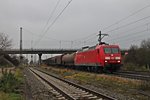 Mit einem gemischten Güterzug fuhr am 29.11.2014 die 145 029-5 durch Müllheim (Baden) in Richtung Schweizer Grenze.