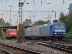 145-CL 204 am 23.09.2011 mit einem Containerzug am Haken bei der Einfahrt in Aachen West.Links im Hintergrund rangiert 185 050-2.