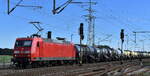DB Cargo AG, Mainz mit ihrer  145 023-8  (NVR:  91 80 6145 023-8 D-DB ) und einem Kesselwagenzug (Schwefelsäure mit mehr als 51 % Säure) am 21.09.23 Durchfahrt Bahnhof Rodleben.