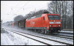 145020-4 Cargo fährt hier am 31.1.2003 um 10.12 Uhr mit einem Güterzug in Richtung Osnabrück durch den Bahnhof Natrup - Hagen.