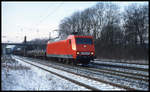 DB 145068-3 fährt am 1.2.2003 um 9.34 Uhr mit einem Güterzug in Richtung Osnabrück durch den Bahnhof Natrup - Hagen.